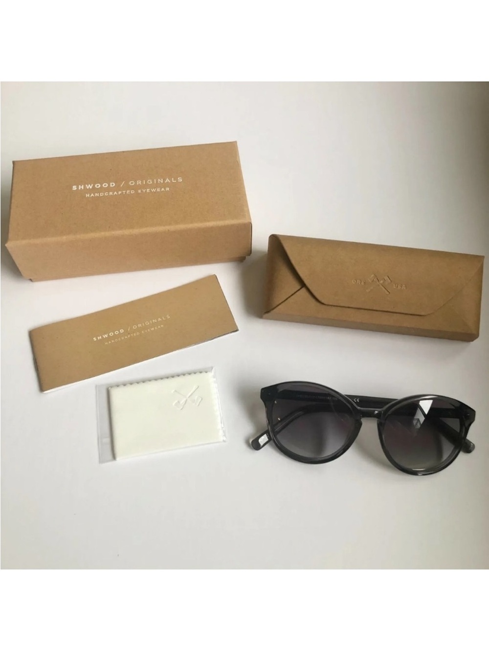 Shwood Bailey smoke grey sunglasses with a round, feminine silhouette